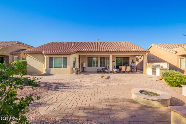 a view of a house with a tree in a yard