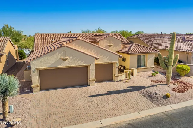 an aerial view of a house with a mountain view