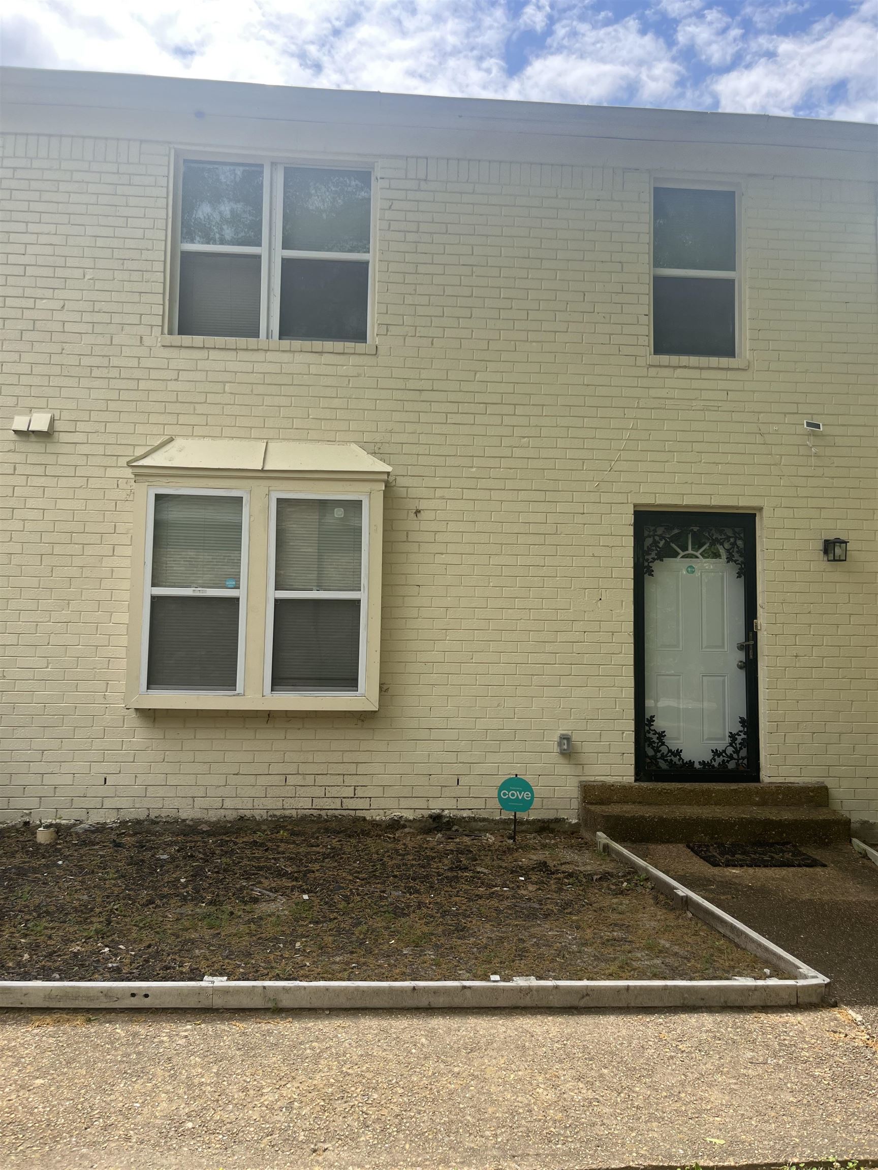 View of side of home with brick siding