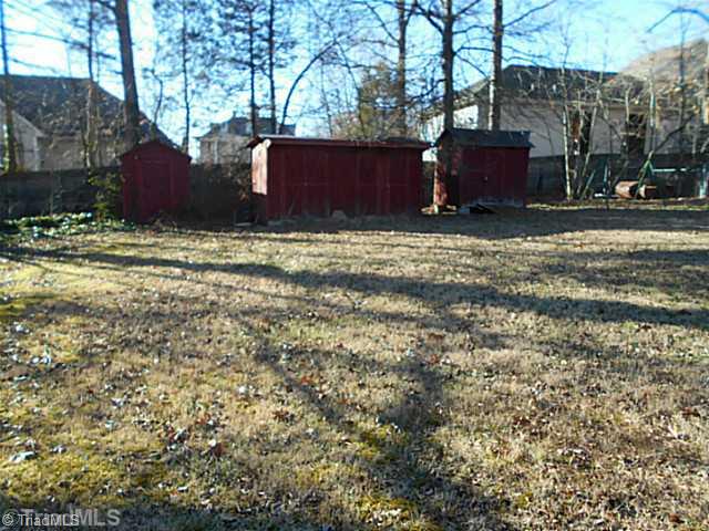 4009 McKinley Street High Point, NC 27265 - Photo 14 of 15 Yard/Garden. Large fenced backyard has storage units