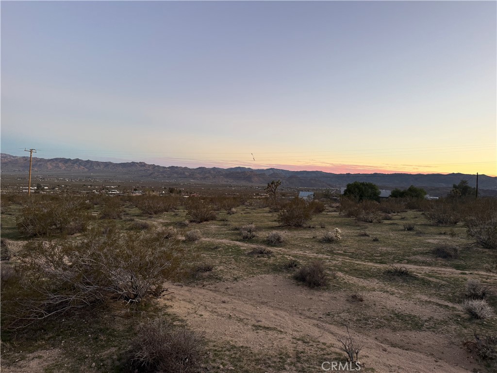 0 Campanula Street Joshua Tree, CA 92252 - Photo 12 of 20 a view of a large mountain with mountains in the background