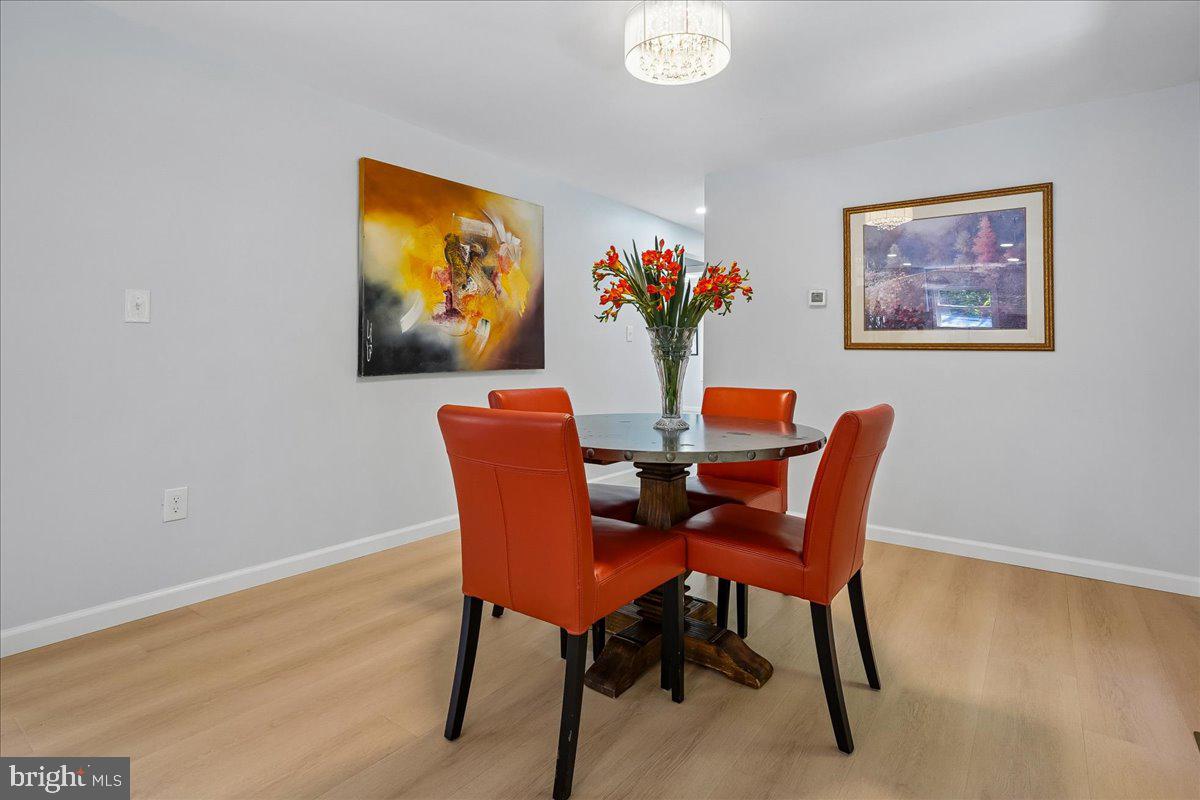 523 Widewater Road Stafford, VA 22554 - Photo 13 of 57 a dining room with furniture and wooden floor