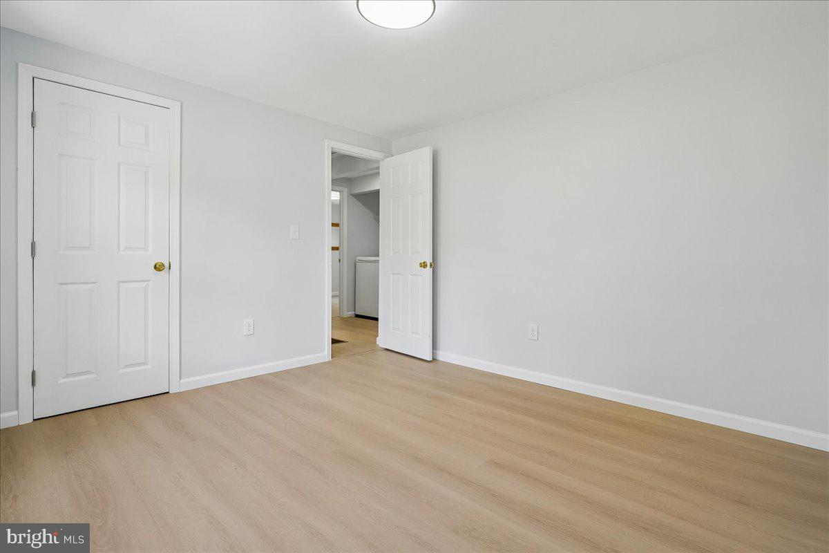 523 Widewater Road Stafford, VA 22554 - Photo 24 of 57 a view of an empty room with wooden floor