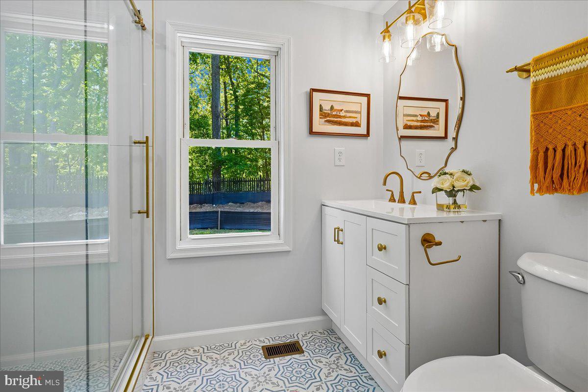 523 Widewater Road Stafford, VA 22554 - Photo 34 of 57 a bathroom with a sink toilet and window
