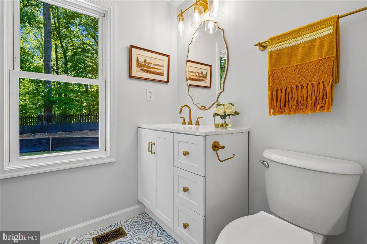 523 Widewater Road Stafford, VA 22554 - Photo 36 of 57 a bathroom with a toilet a sink and a mirror