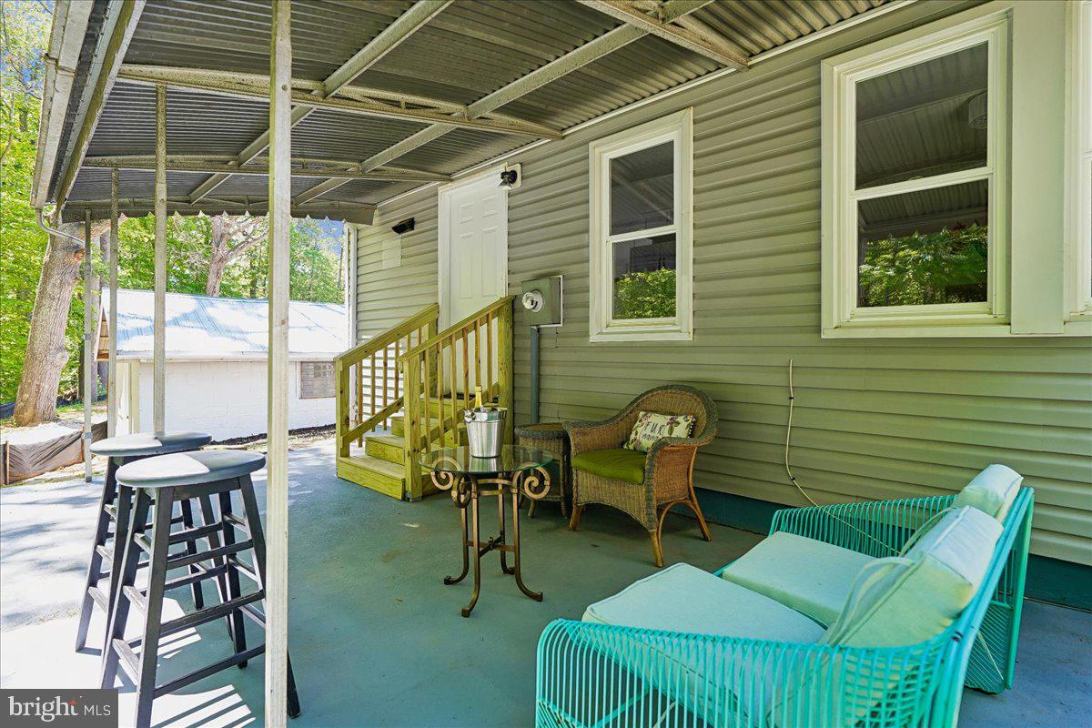 523 Widewater Road Stafford, VA 22554 - Photo 42 of 57 a balcony with chairs and a potted plant