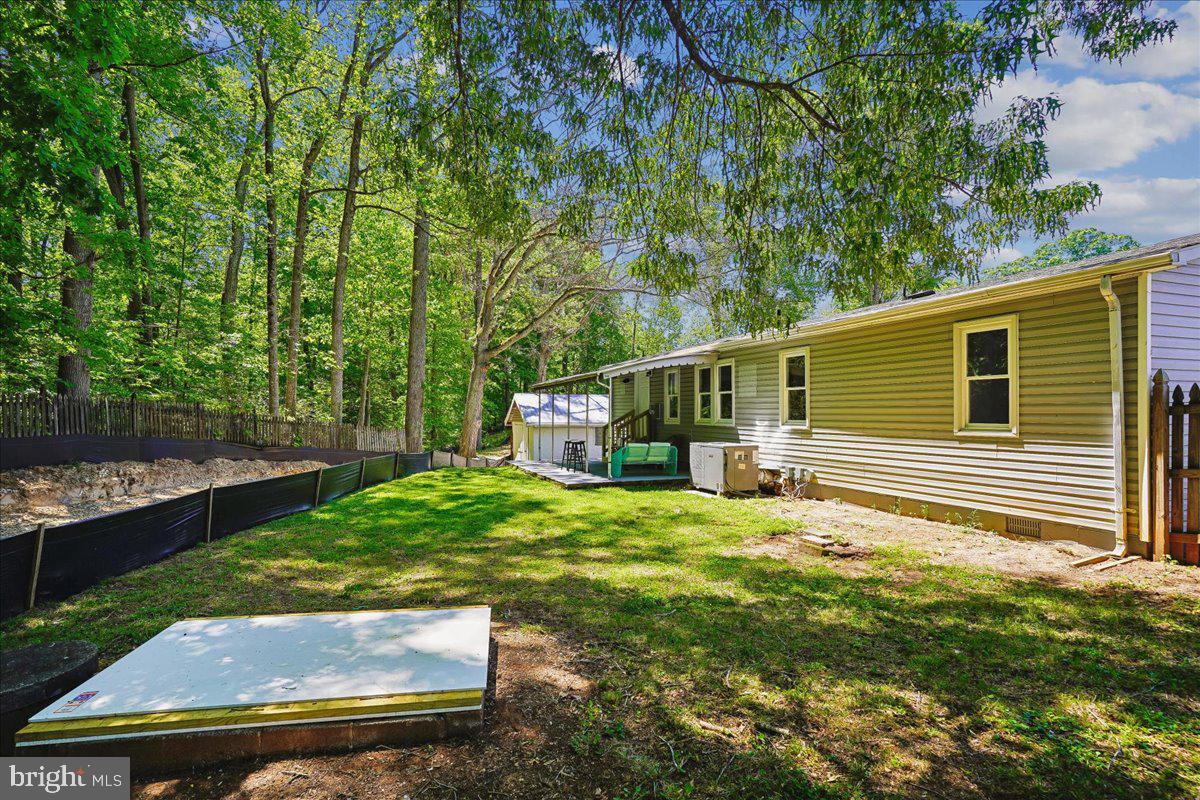 523 Widewater Road Stafford, VA 22554 - Photo 45 of 57 a view of a backyard with plants and large trees