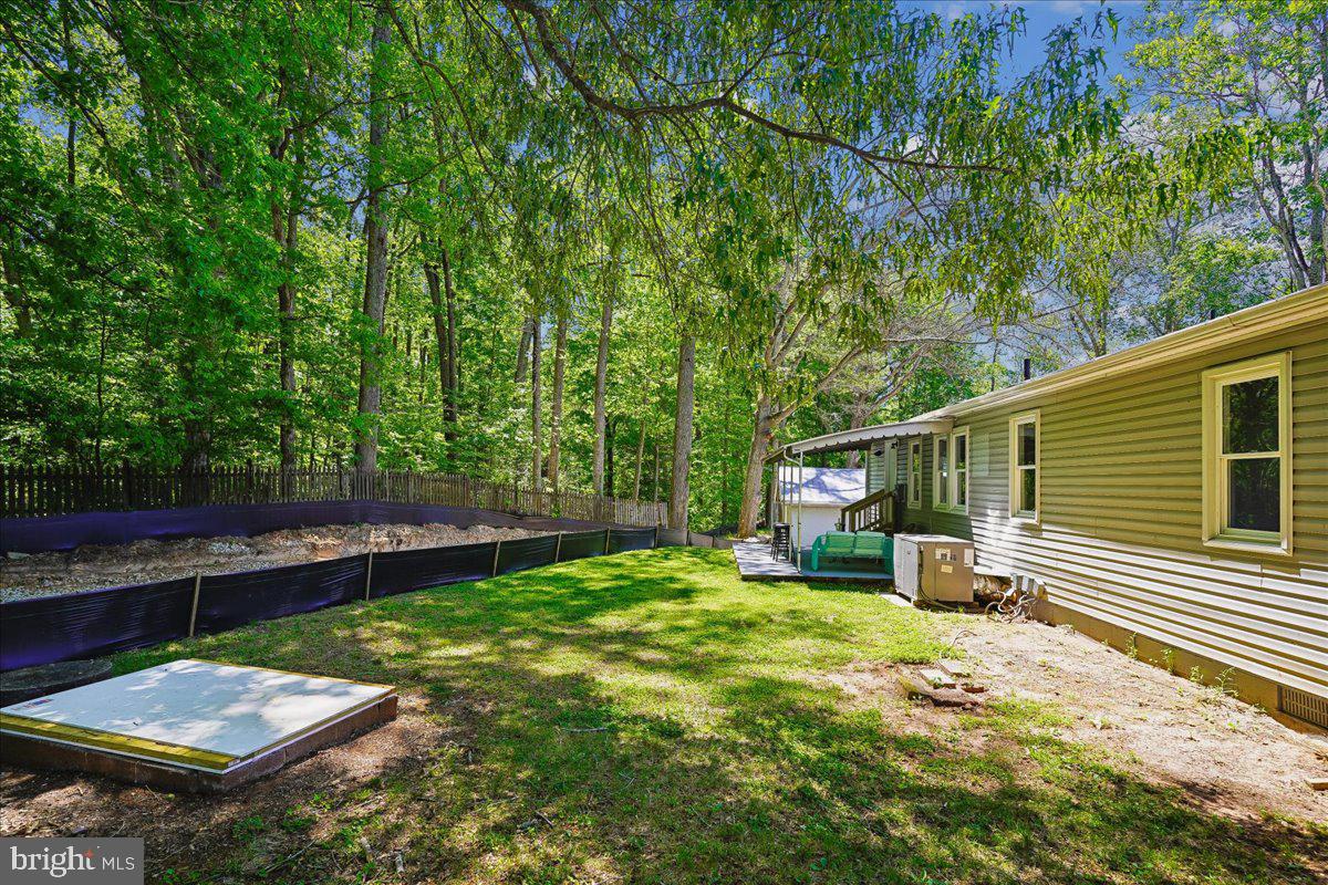 523 Widewater Road Stafford, VA 22554 - Photo 47 of 57 a view of a backyard with plants and a patio