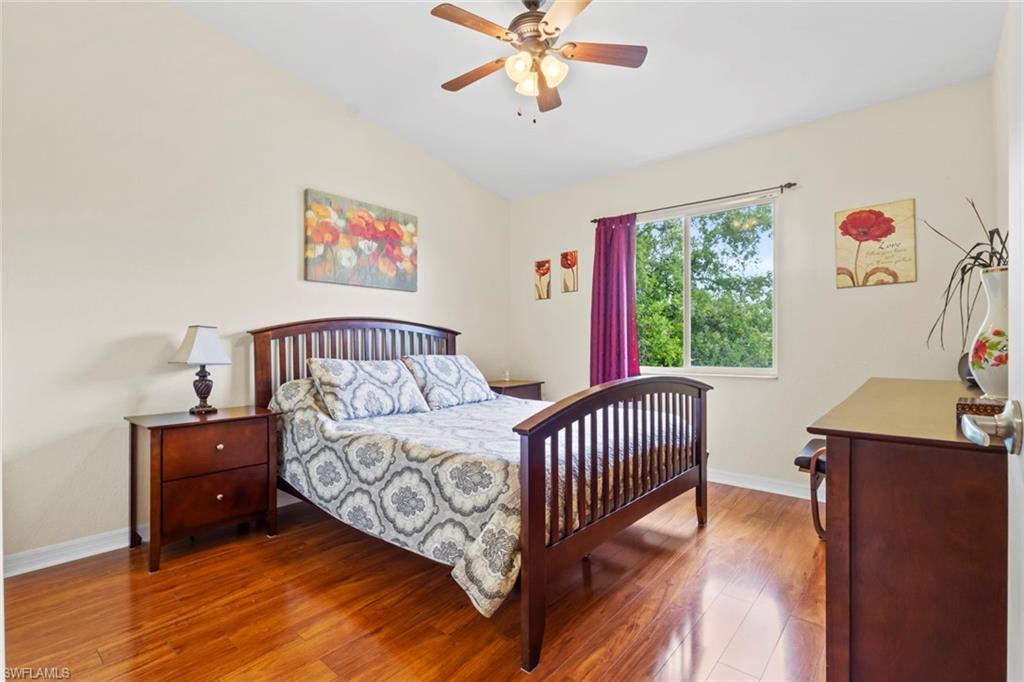 8288 Key Royal Lane, Unit 1435 Naples, FL 34119 - Photo 13 of 26 a bedroom with a bed and a window
