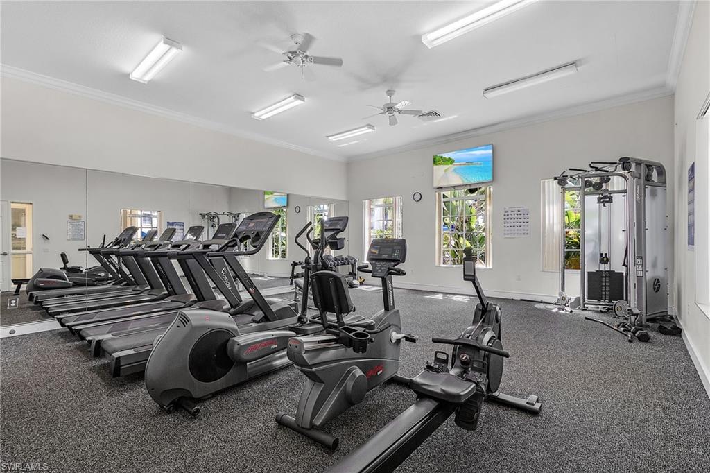 8288 Key Royal Lane, Unit 1435 Naples, FL 34119 - Photo 24 of 26 a room with gym equipment and windows