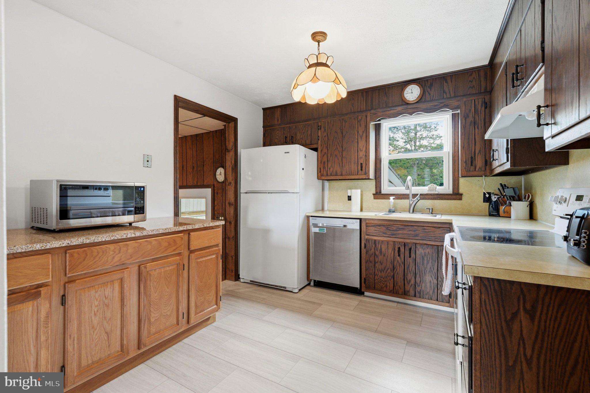 1385 Woodmere Road Pottstown, PA 19464 - Photo 15 of 63 Charming kitchen with classic wood accents.