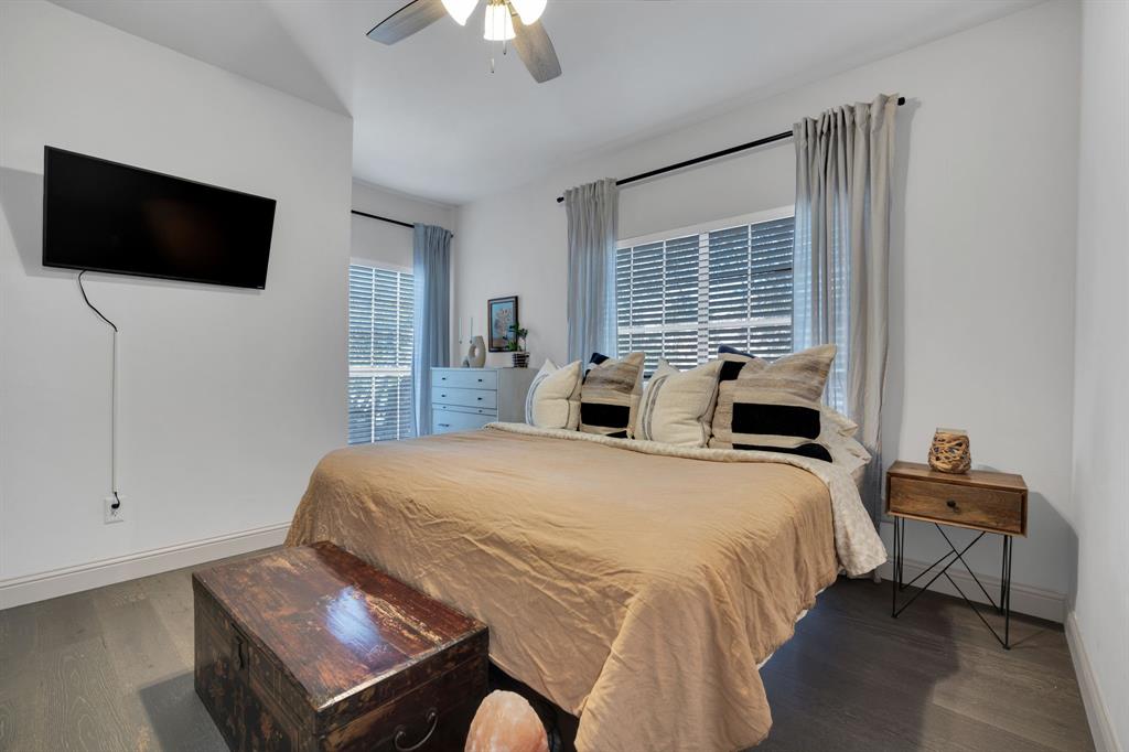 5619 Preston Oaks Road, Unit 802 Dallas, TX 75254 - Photo 18 of 27 a bedroom with a bed tv and a window