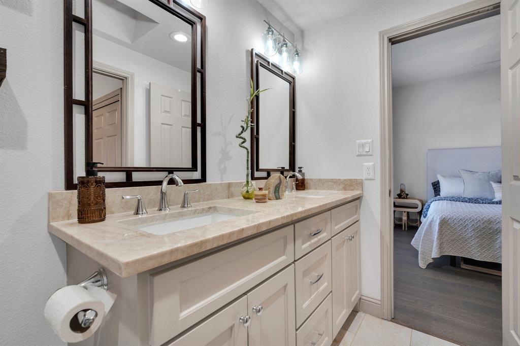 5619 Preston Oaks Road, Unit 802 Dallas, TX 75254 - Photo 20 of 27 a bathroom with a sink and a mirror