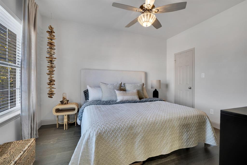 5619 Preston Oaks Road, Unit 802 Dallas, TX 75254 - Photo 22 of 27 a bedroom with a bed and a chandelier