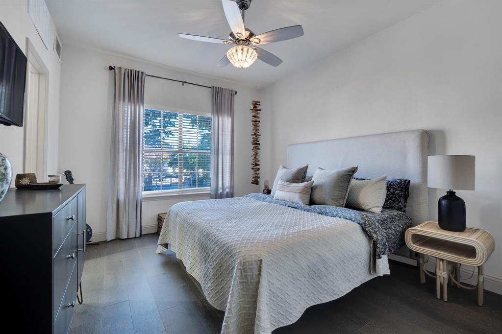 5619 Preston Oaks Road, Unit 802 Dallas, TX 75254 - Photo 23 of 27 a bedroom with a bed and a chandelier