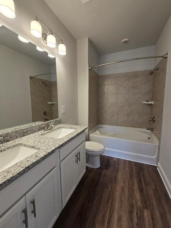 6210 Ripple Way, Unit 90 Atlanta, GA 30349 - Photo 19 of 23 a bathroom with a granite countertop sink toilet and shower