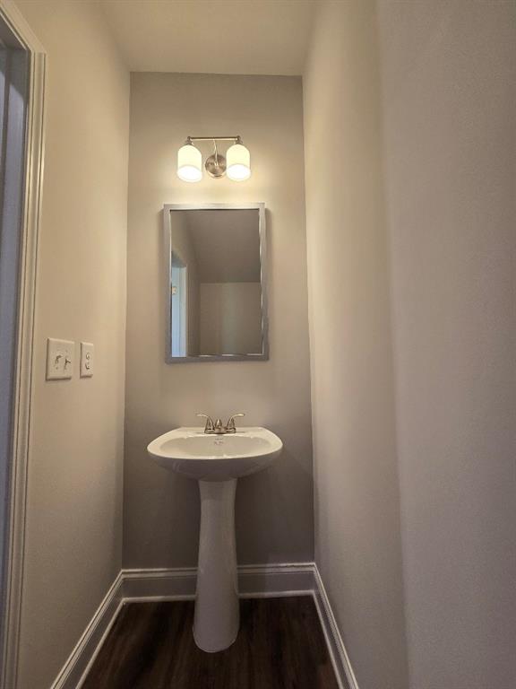 6210 Ripple Way, Unit 90 Atlanta, GA 30349 - Photo 6 of 23 a bathroom with a sink toilet and mirror
