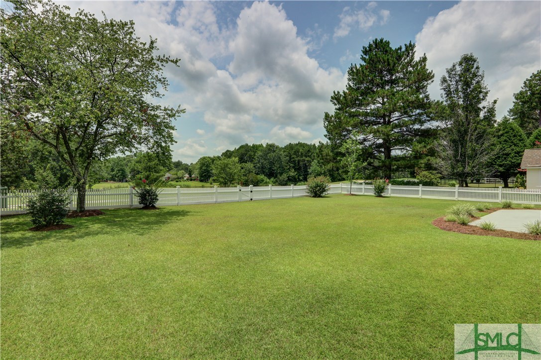 212 Walthour Drive Rincon, GA 31326 - Photo 24 of 30 Large, fenced backyard overlooking the view of the