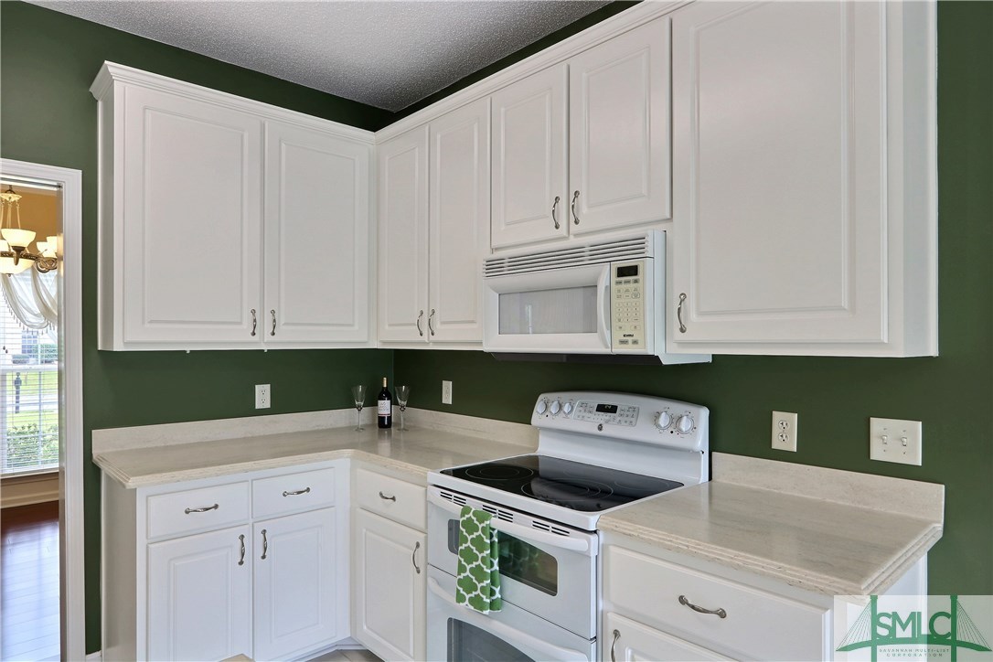 212 Walthour Drive Rincon, GA 31326 - Photo 6 of 30 The kitchen features solid surface countertops, al
