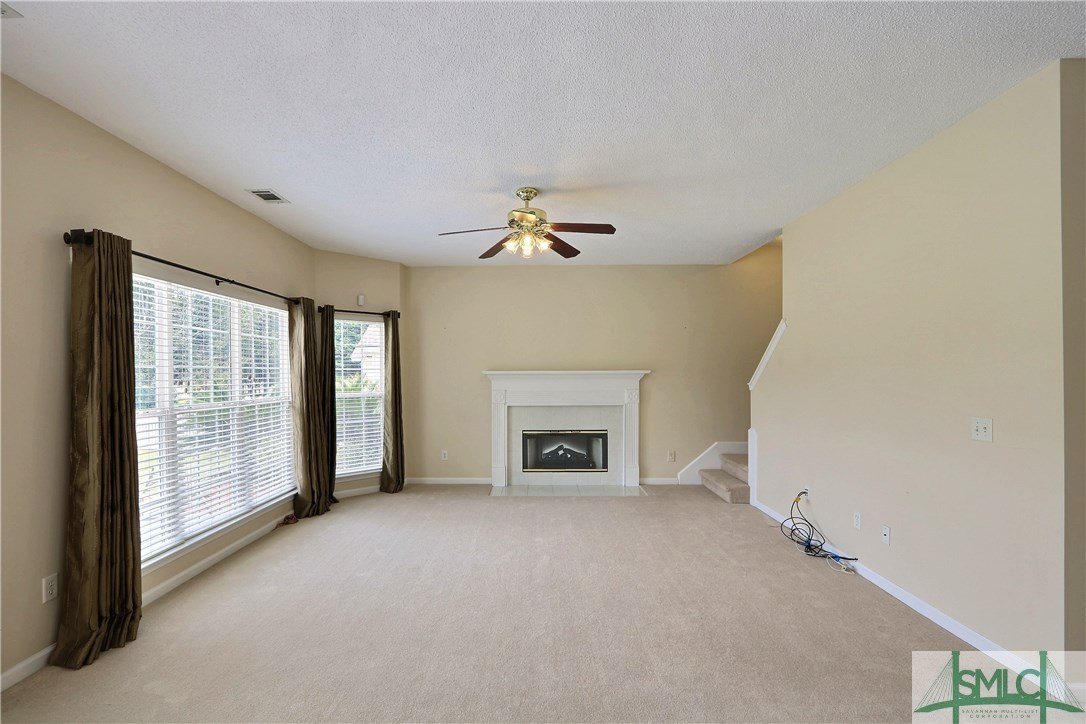 212 Walthour Drive Rincon, GA 31326 - Photo 9 of 30 Upgraded carpet in the family room, fireplace with