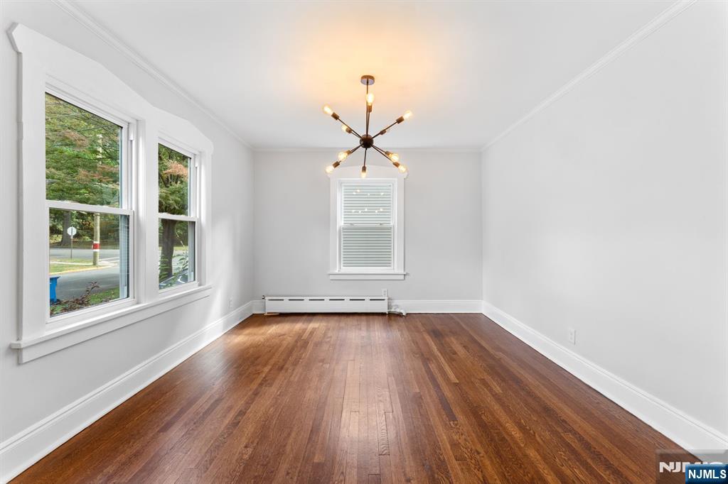 177 East Pierrepont Avenue Rutherford, NJ 07070 - Photo 11 of 27 a view of wooden floor and windows in a room