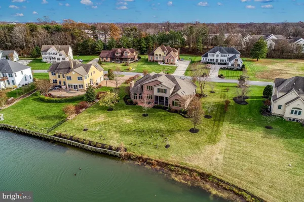 an aerial view of a house with lake view