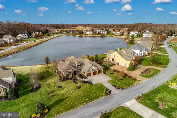 an aerial view of a house with a ocean view