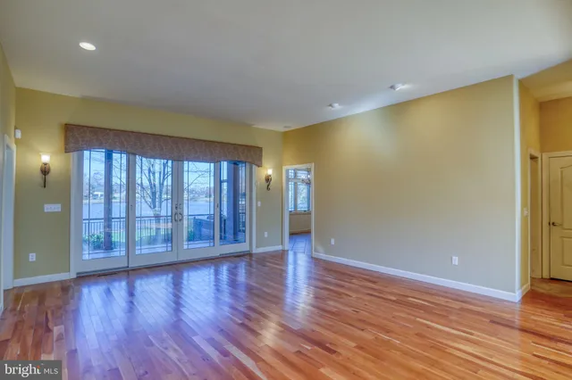 a kitchen with stainless steel appliances granite countertop a sink and a refrigerator