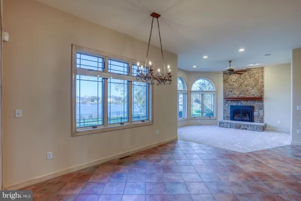 a kitchen with stainless steel appliances granite countertop a sink and a refrigerator