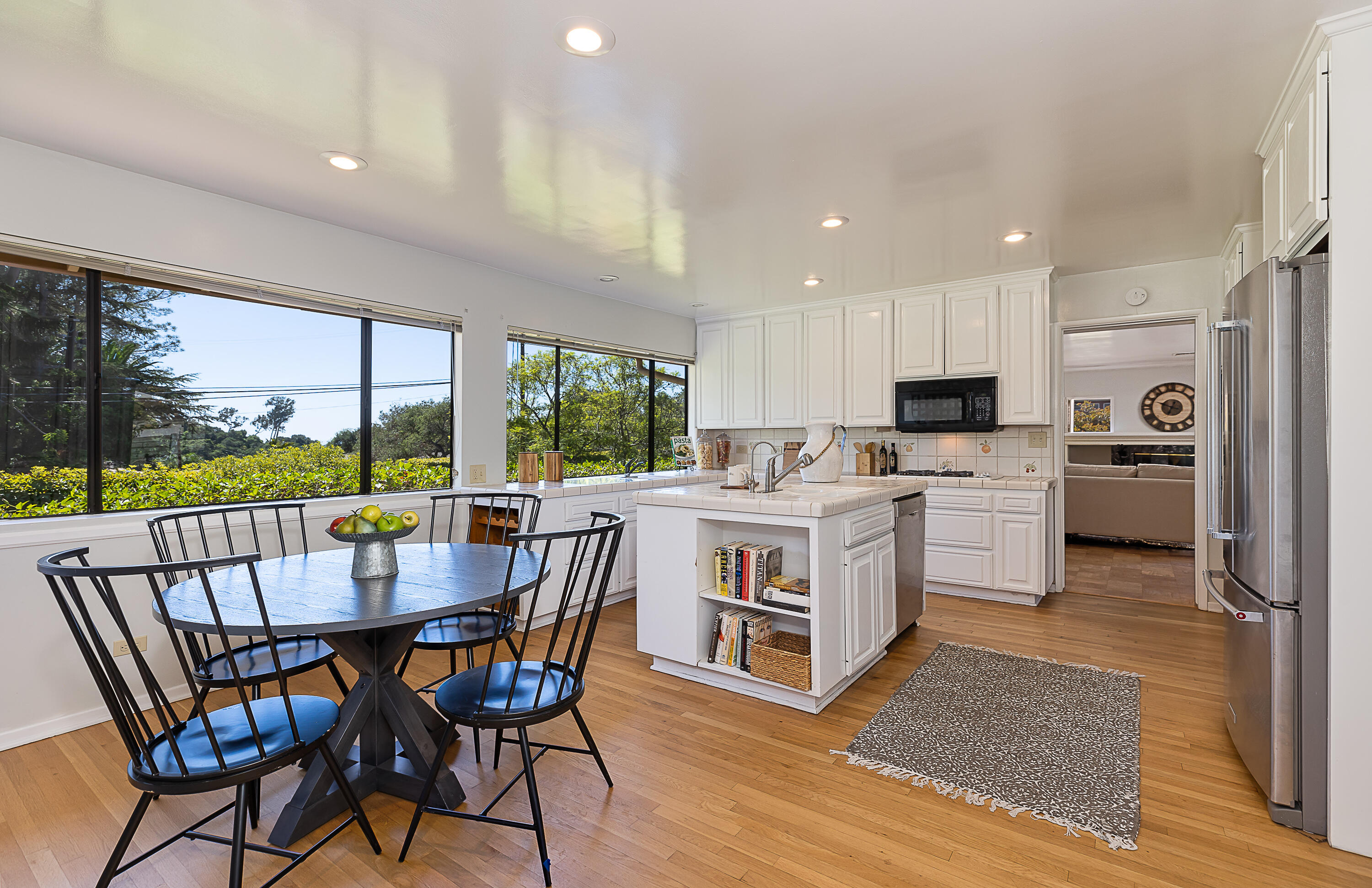 317 Alston Road Santa Barbara, CA 93108 - Photo 7 of 20 a kitchen with a table chairs stove and cabinets
