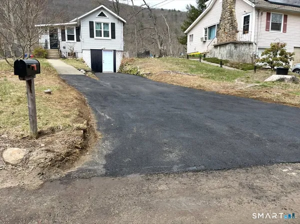 a view of side of snow on the road