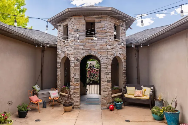 a front view of a house with outdoor seating