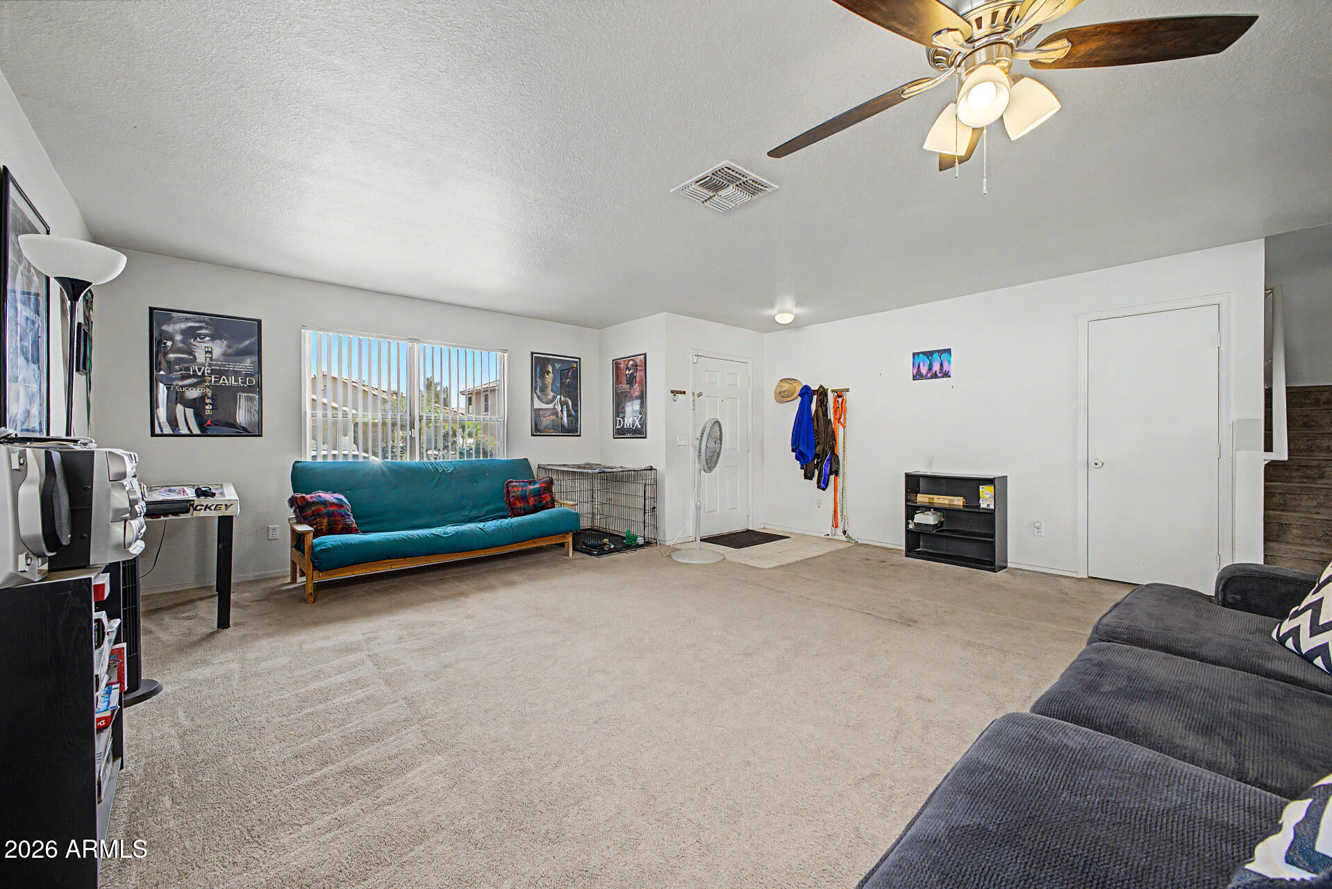2607 West Bloch Road Phoenix, AZ 85041 - Photo 6 of 34 a view of a livingroom with furniture and a flat screen tv