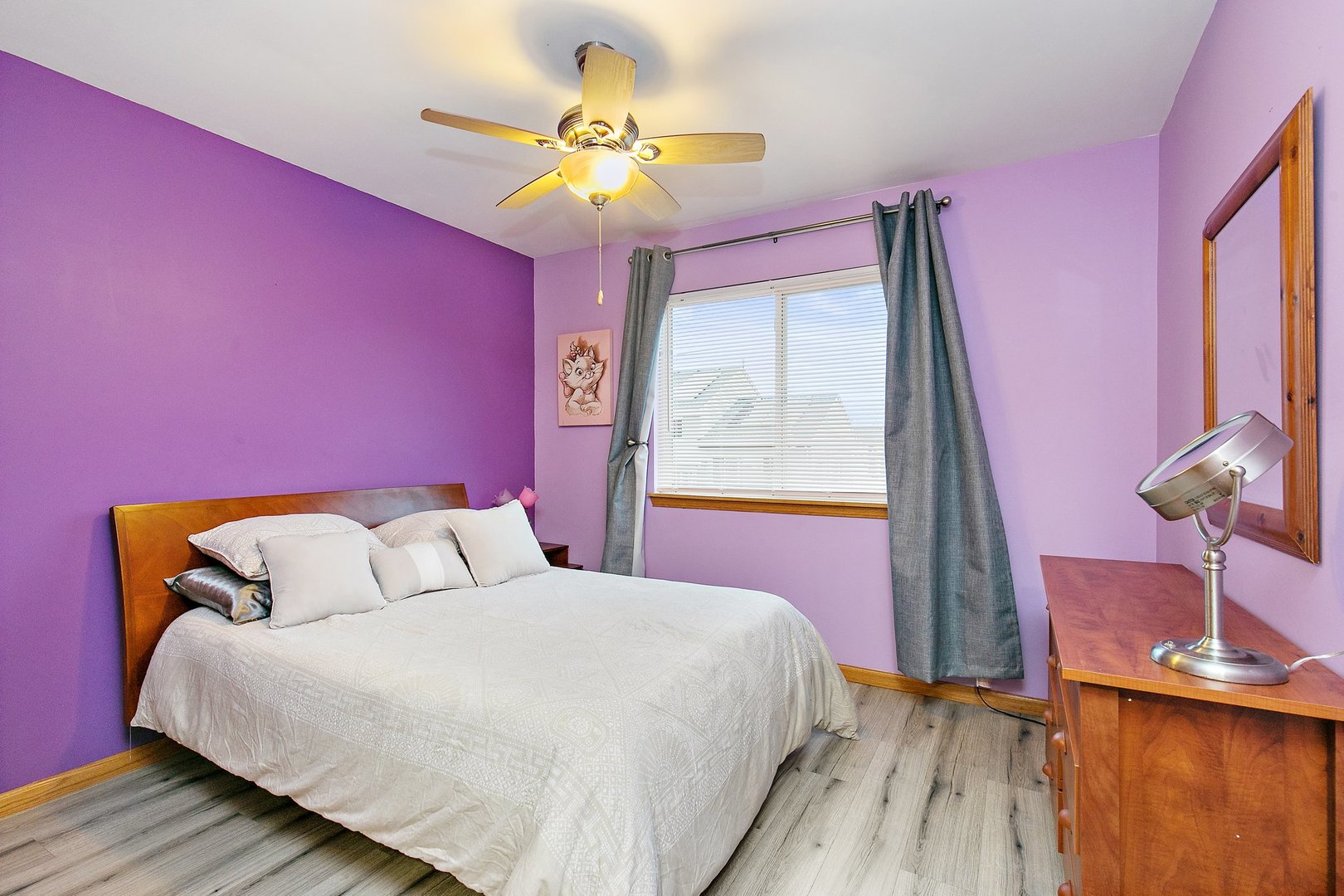 25649 Brooks Farm Road Round Lake, IL 60073 - Photo 19 of 24 a bedroom with a bed and a chandelier
