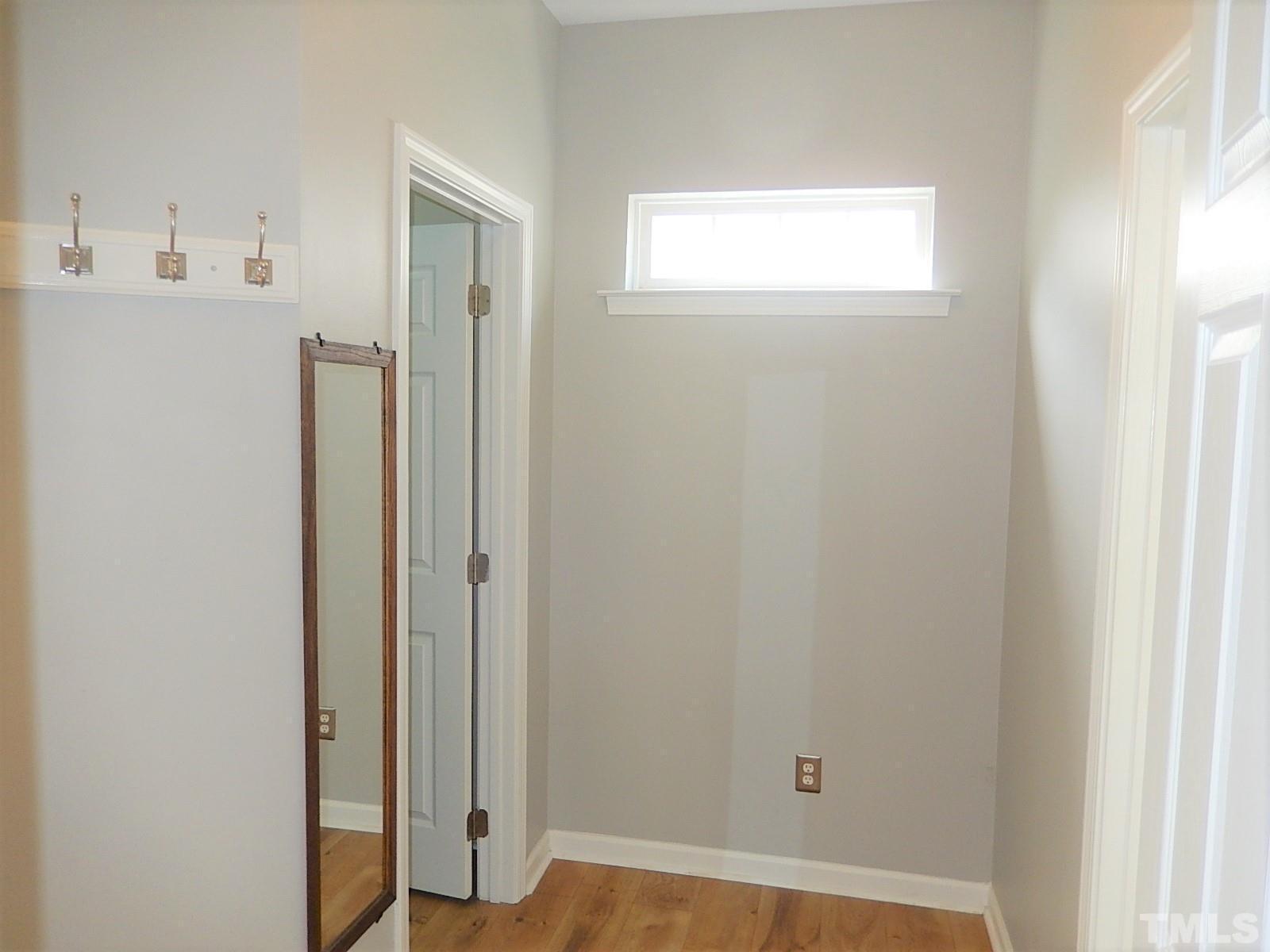 4717 Delta Ridge Court Raleigh, NC 27612 - Photo 11 of 30 a view of a hallway with wooden floor