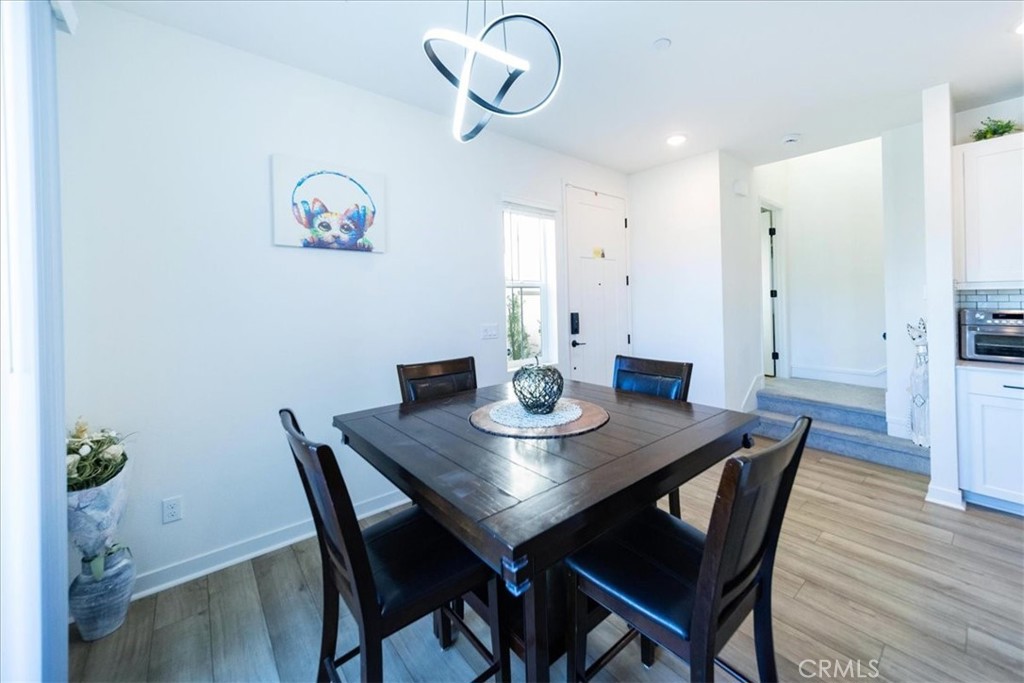 35246 Blossom Place Fallbrook, CA 92028 - Photo 11 of 62 a view of a dining room with furniture and wooden floor
