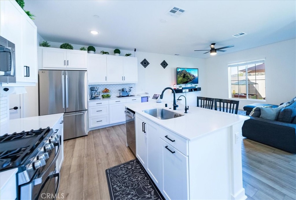 35246 Blossom Place Fallbrook, CA 92028 - Photo 12 of 62 a kitchen with a sink appliances a counter space and a window