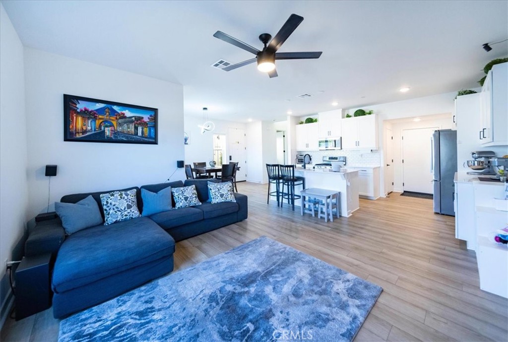 35246 Blossom Place Fallbrook, CA 92028 - Photo 20 of 62 a living room with furniture and kitchen view