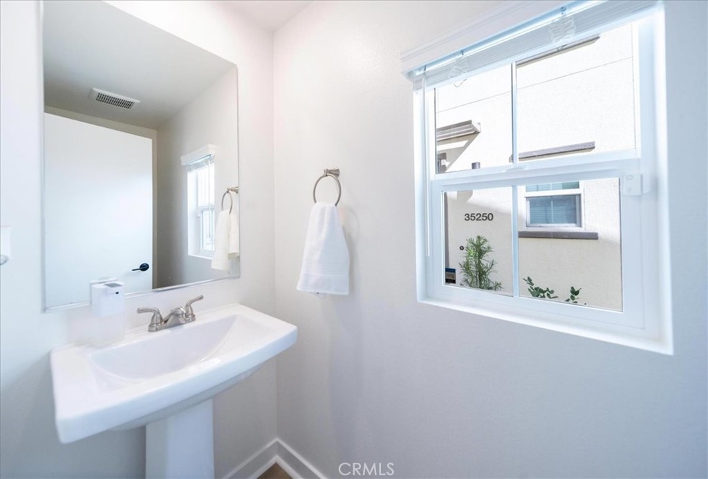 35246 Blossom Place Fallbrook, CA 92028 - Photo 22 of 62 a bathroom with a sink and a mirror