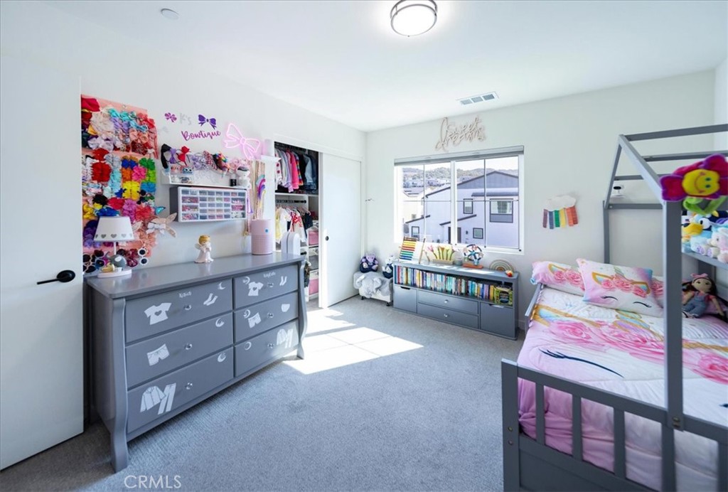 35246 Blossom Place Fallbrook, CA 92028 - Photo 27 of 62 a bedroom with furniture a baby crib and a window
