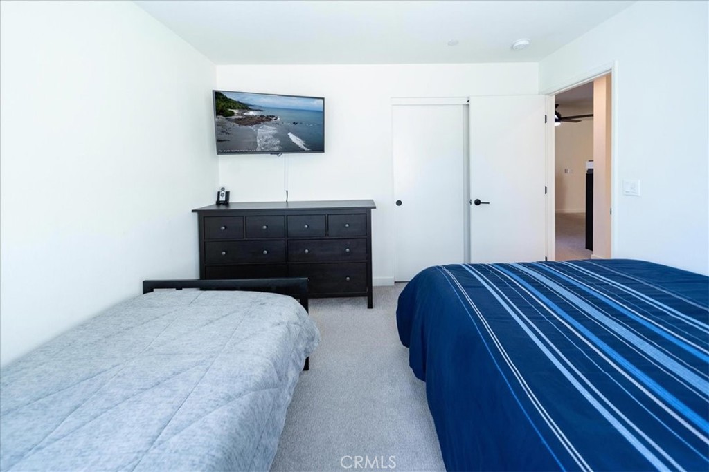 35246 Blossom Place Fallbrook, CA 92028 - Photo 33 of 62 a bedroom with a bed and a flat screen tv