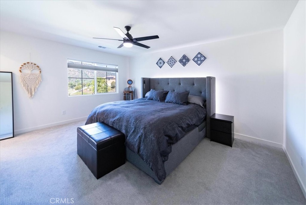 35246 Blossom Place Fallbrook, CA 92028 - Photo 37 of 62 a bedroom with a bed and a table