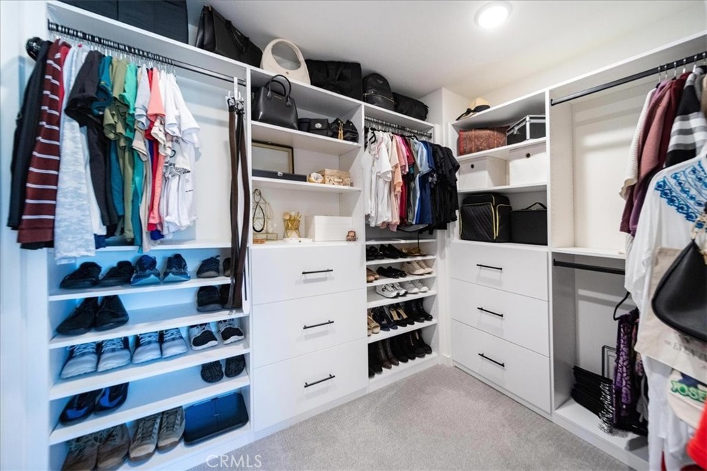 35246 Blossom Place Fallbrook, CA 92028 - Photo 42 of 62 a view of walk in closet with clothes and shoes