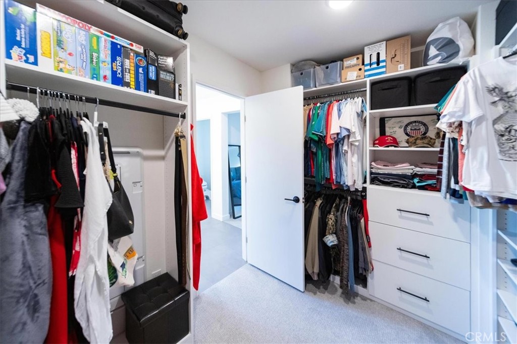 35246 Blossom Place Fallbrook, CA 92028 - Photo 43 of 62 a view of walk in closet with clothes and shoes