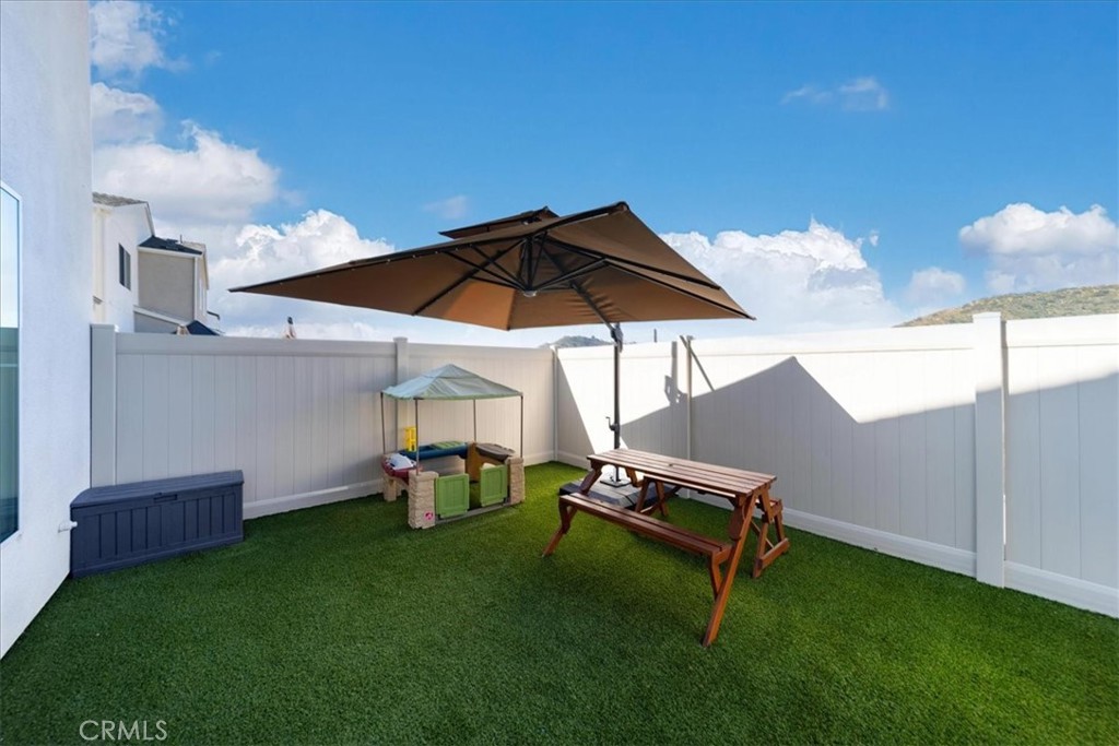 35246 Blossom Place Fallbrook, CA 92028 - Photo 47 of 62 a view of a backyard with chairs and a grill