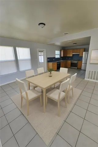 a view of a dining room with furniture