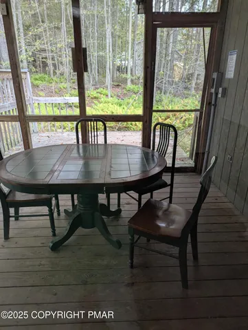 a view of a room with furniture and window