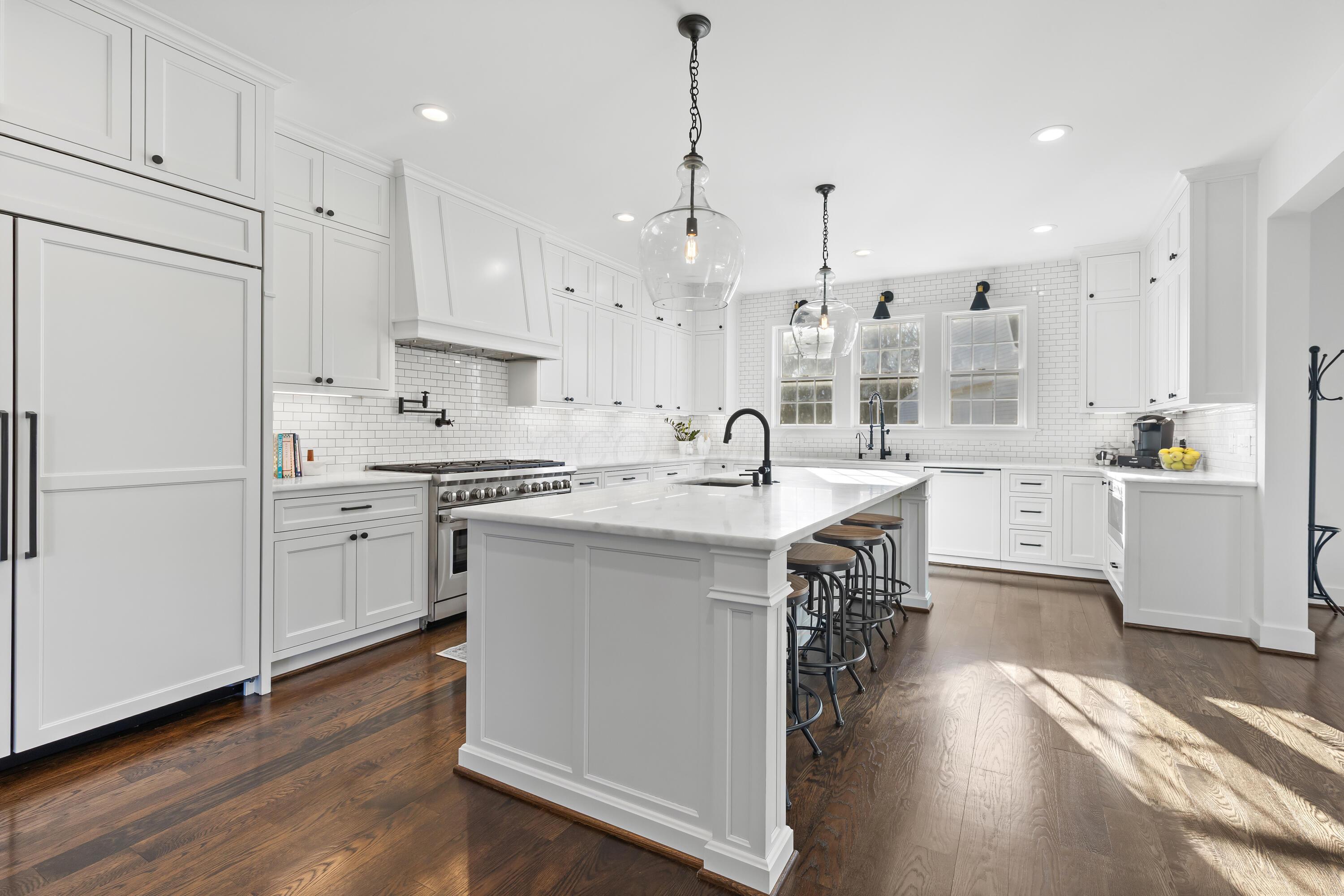 1364 Dale Ford Road Delaware, OH 43015 - Photo 29 of 112 • Hardwood flooring • White painted walls • Can lighting • Custom built white cabinets • Marble countertops • 10’ center island with pendant lighting & breakfast bar ledge • Wall pantry with pull-outs & book shelves • (2) big pendant lights • Wolf® drawer microwave • Bosch® dishwasher • (2) lazy susans • Single bowl, stainless steel sink with sprayer & reverse osmosis (negotiable) • Under cabinet lighting • Bosch® electric 36” oven with side swinging door • 48” Wolf® 8 burner gas stove with convection oven • Pot filler • Custom range hood (vents-out & return air) • 48” Sub-Zero® paneled refrigerator • Hidden outlets on island