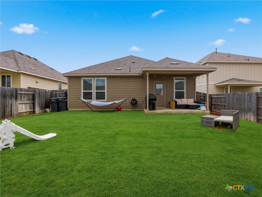 198 Orange Road Buda, TX 78610 - Photo 26 of 28 a view of a house with a backyard
