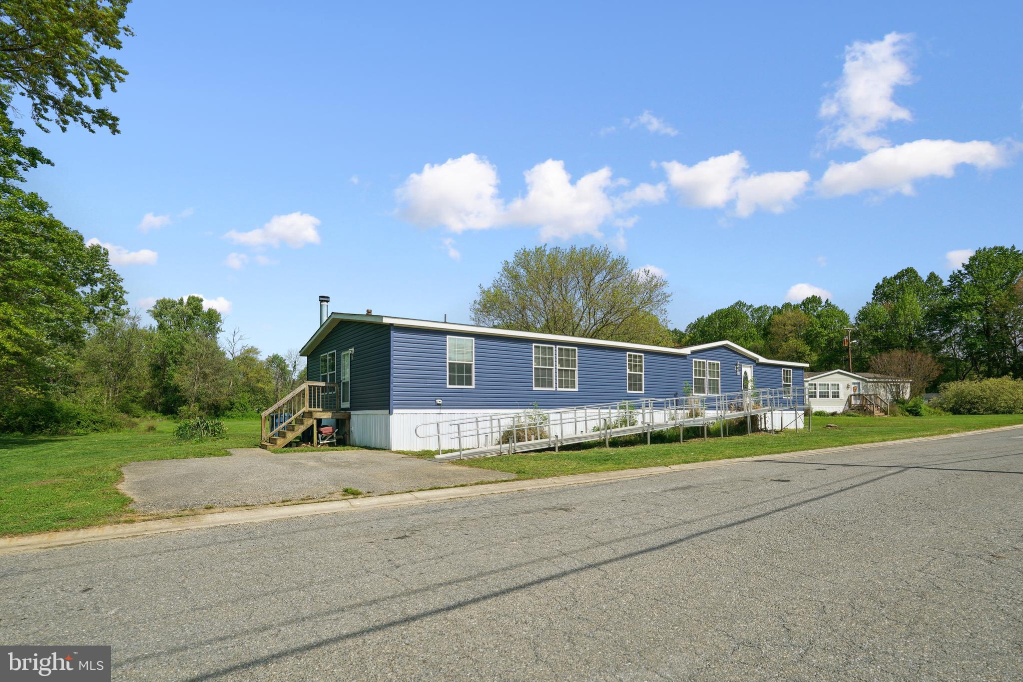 a view of house with outdoor space and street view